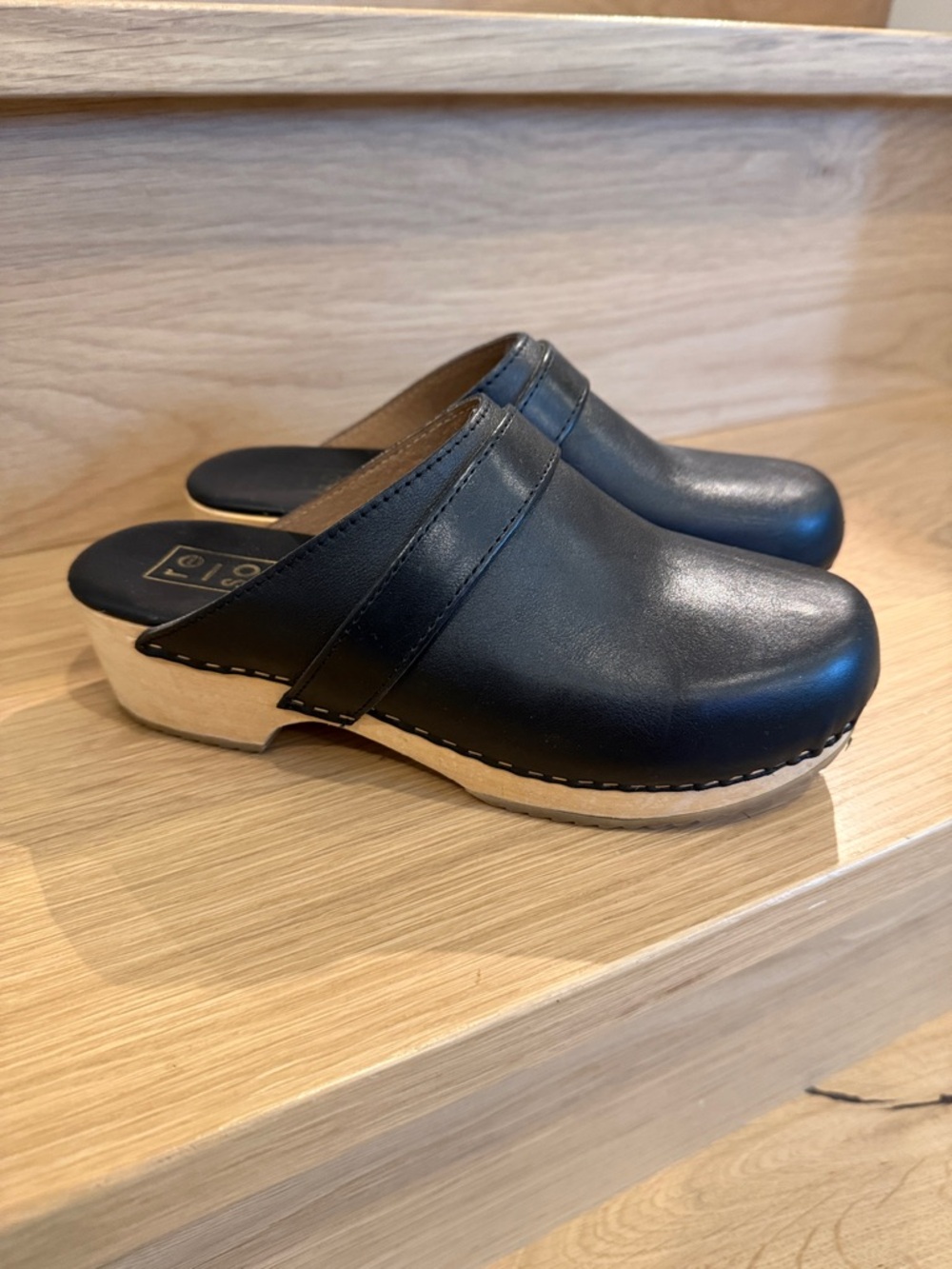 Black leather clog mules